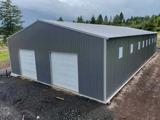 Gray metal shop with two roll-up doors