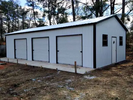 White three-bay garage