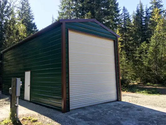 Dark green garage with roll-up door