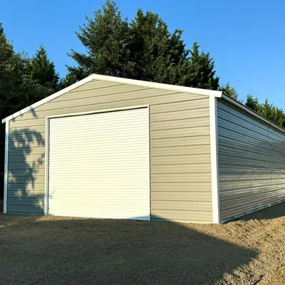 Cream enclosed garage with large roll-up door
