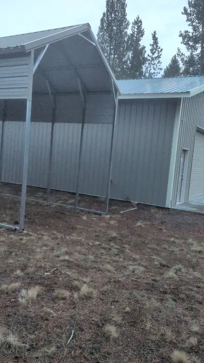 Open-front RV shelter with enclosed gable end